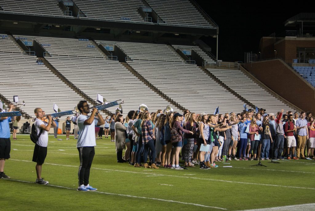 Image of Marching band practicing with Carolina Choir