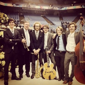 Jazz Students and Ketch pose together on the floor of the Dean Dome with their instruments.