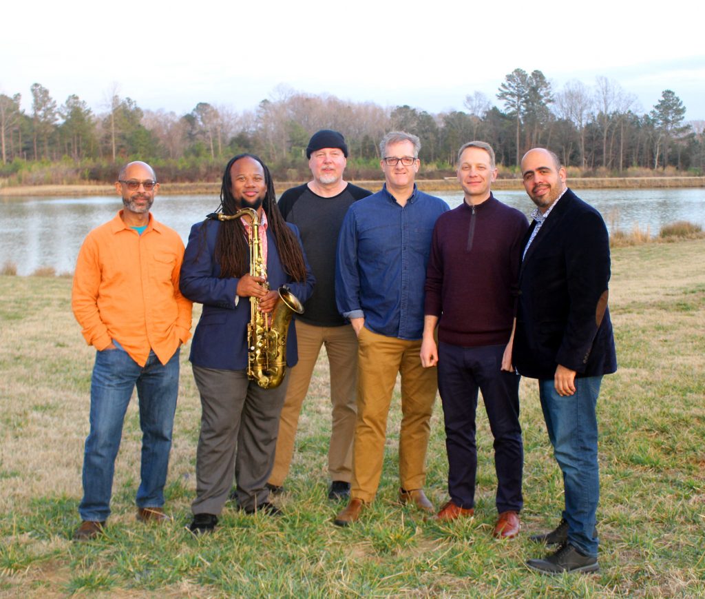 UNC Jazz Faculty pose in front of a lake